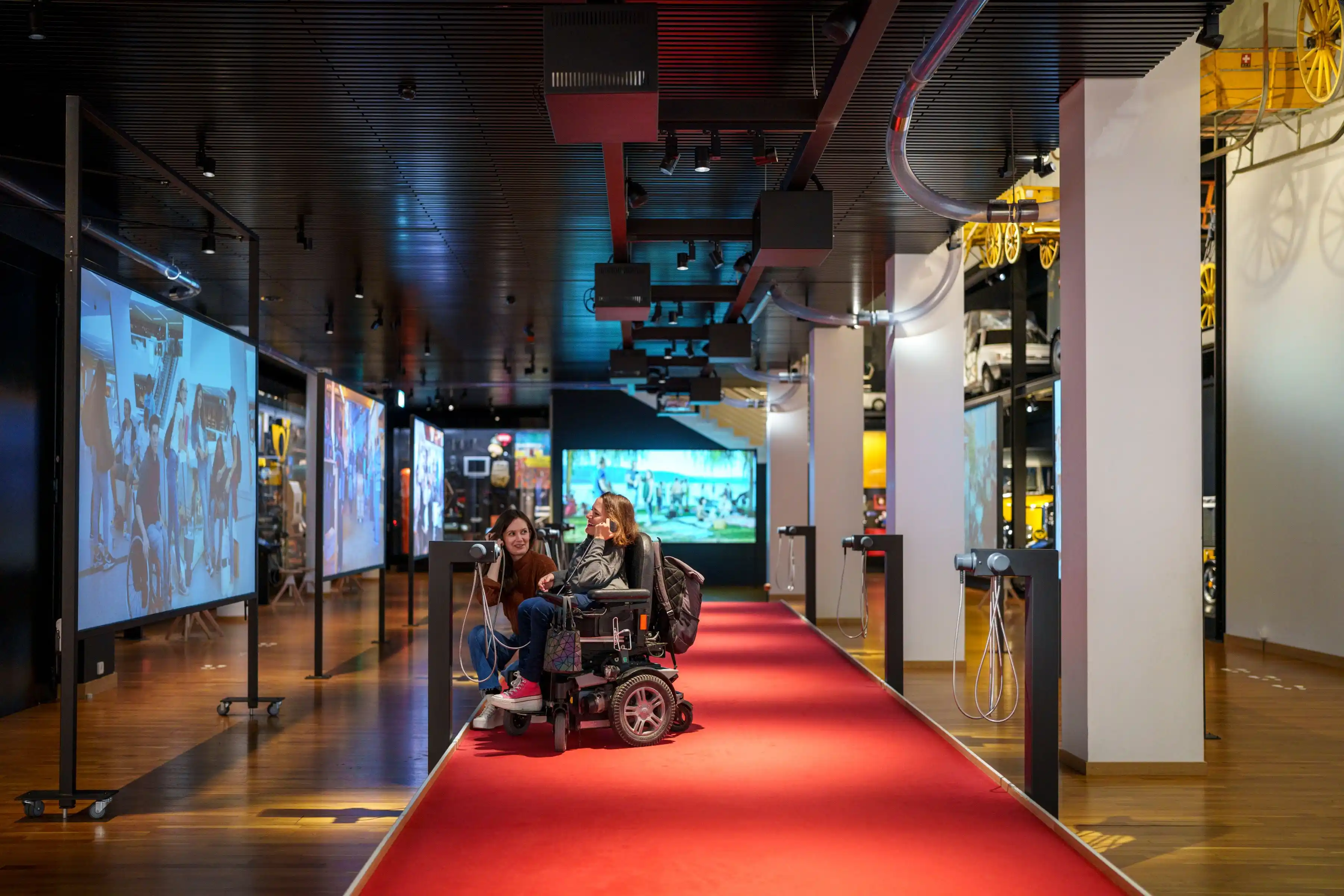 A person experiencing an audio-guided tour at the Museum of Communication, which comes under free museums with Swiss Travel Pass.