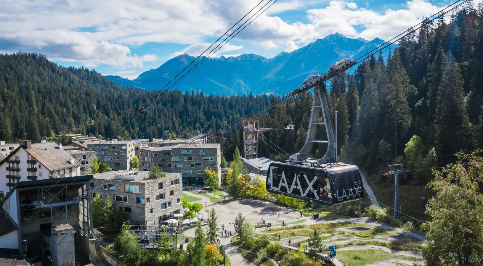 Scenic cable car ride in Laax surrounded by the Swiss Alps, an adventurous yet romantic experience in a curated Switzerland Tour Package for couple.