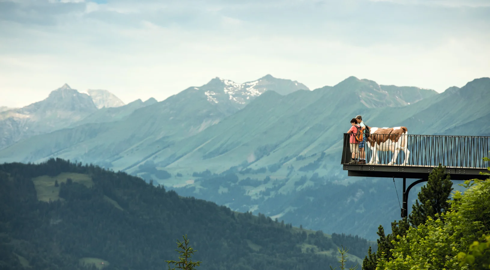 The Two Lakes Bridge viewing platform at Harder Kulm, the Top of Interlaken, overlooking Lake Thun, Lake Brienz and the Eiger, Mönch and Jungfrau peaks in the Bernese Oberland, Switzerland